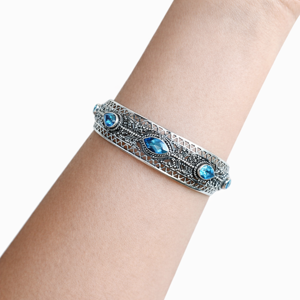 925 silver artisan bracelet with blue topaz stones, cuff design
