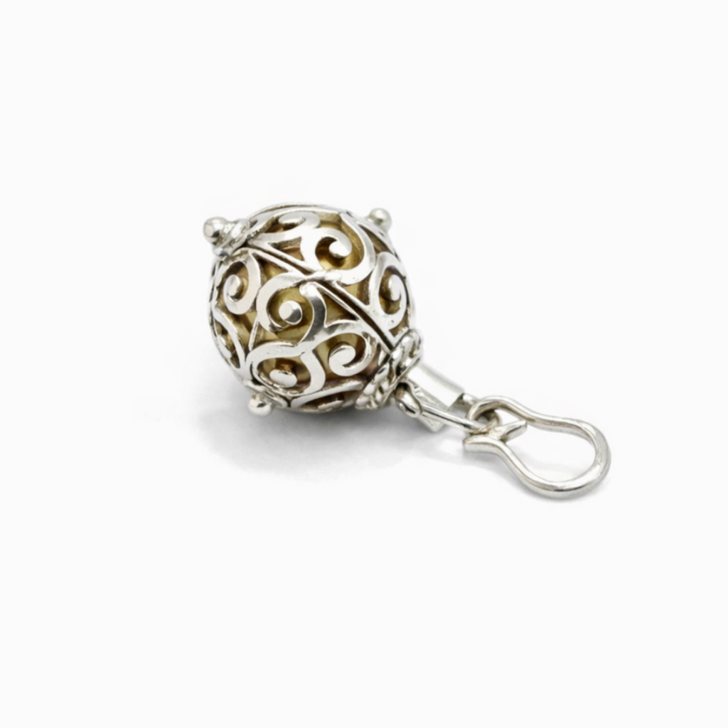 Unique silver ball pendant that produces a soft chime sound