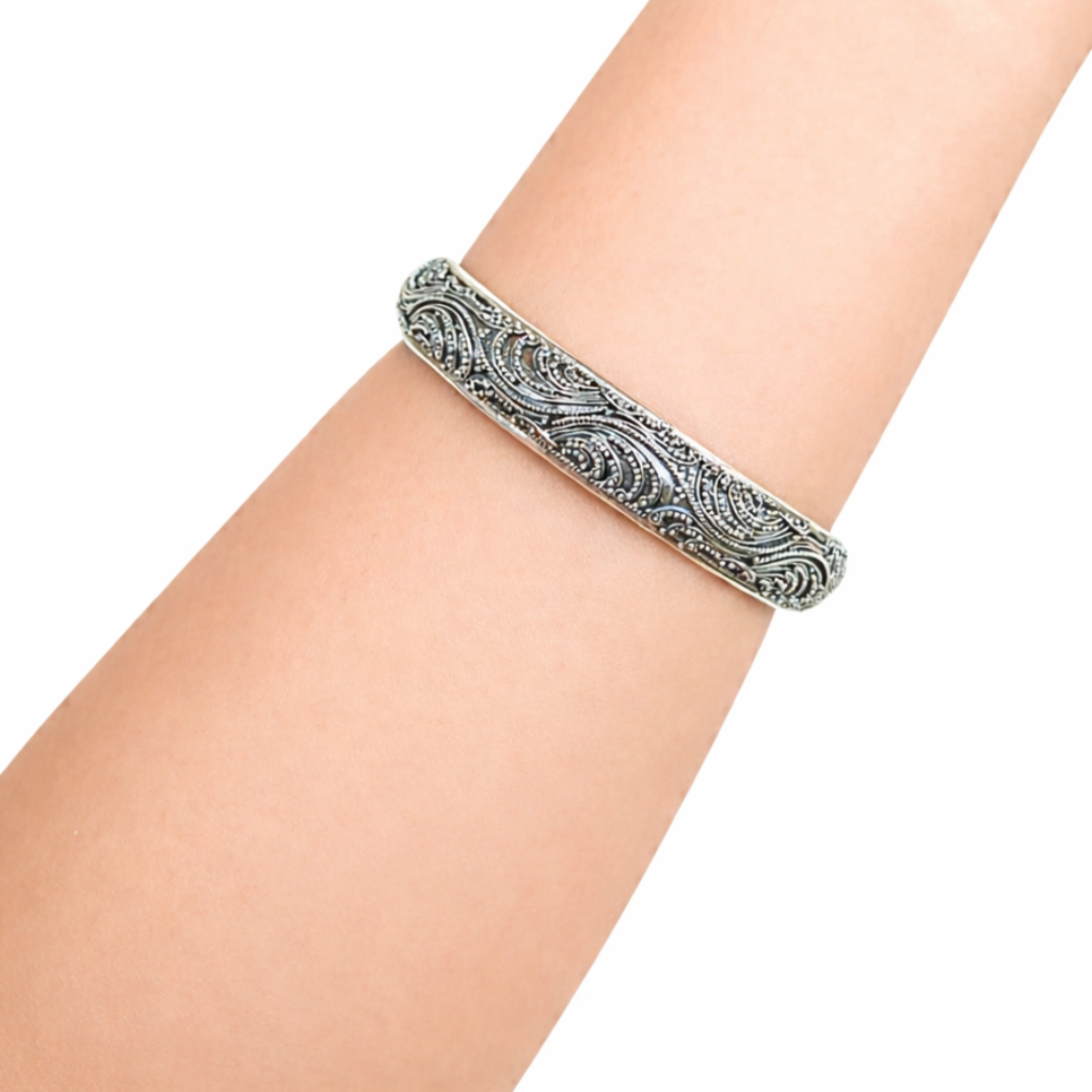 Artisan silver cuff bracelet featuring wave-inspired engraved pattern
